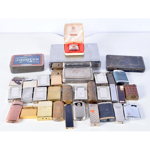 3104 - A collection of lighters and tobacco tins and a vintage rolling machine (33).