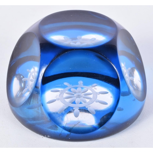 3117 - A Webb Corbett blue ships wheel faceted paper weight 4.5 x 7.5  cm.