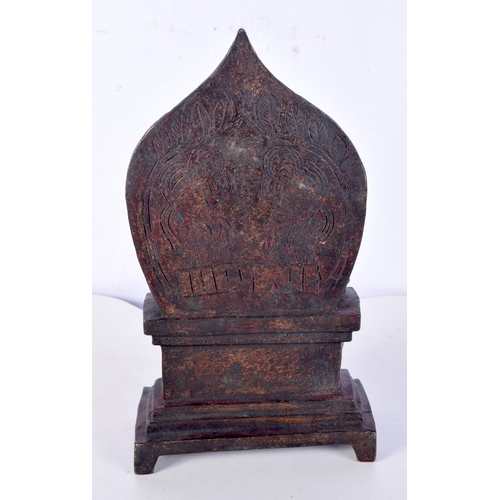 3121 - A Chinese Tibetan bronze statue of Buddhas praying on an altar. 22cm.