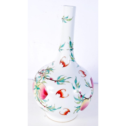 3124 - A large Chinese porcelain vase decorated with foliage, peaches and bats. 37cm.