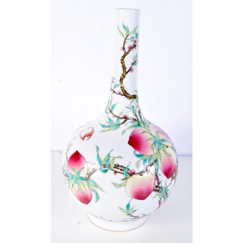 3124 - A large Chinese porcelain vase decorated with foliage, peaches and bats. 37cm.