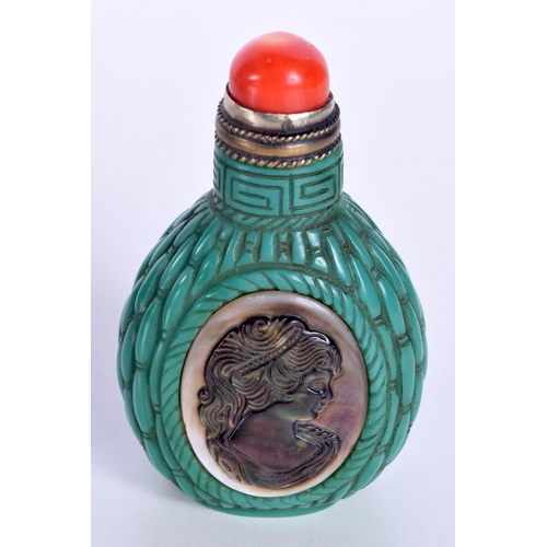 3143 - A Chinese porcelain snuff bottle decorated with a silhouette in Abalone shell. 8cm.