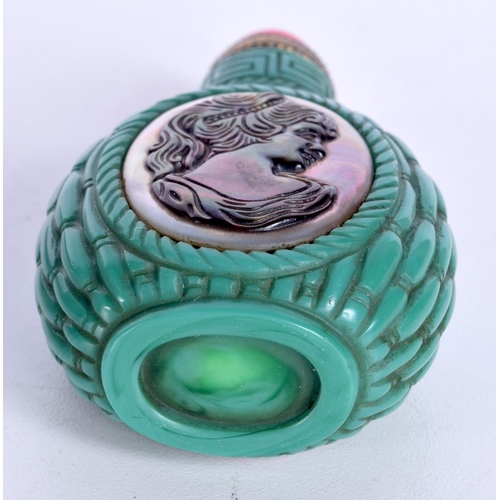 3143 - A Chinese porcelain snuff bottle decorated with a silhouette in Abalone shell. 8cm.