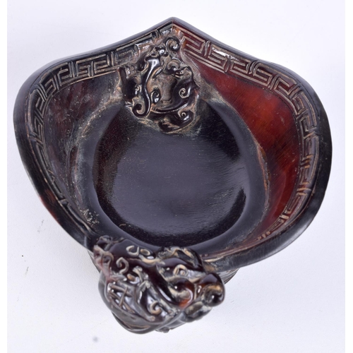 3145 - A Chinese carved horn libation cup. 8 x 12cm.