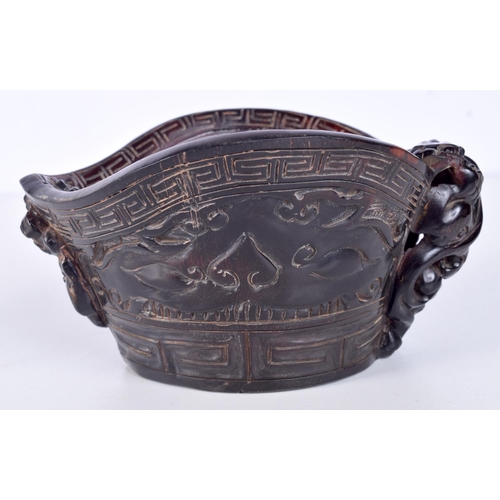 3145 - A Chinese carved horn libation cup. 8 x 12cm.