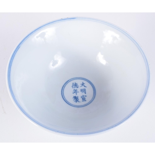 3147 - A Chinese porcelain blue and white stem cup decorated with trailing vines and lotus. 12 x 17cm.