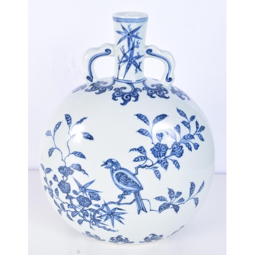 3155 - A Chinese porcelain blue and white moon flask decorated with birds in a tree. 28cm.