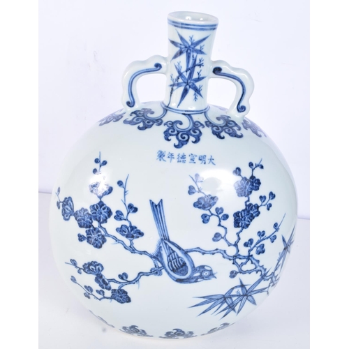 3155 - A Chinese porcelain blue and white moon flask decorated with birds in a tree. 28cm.