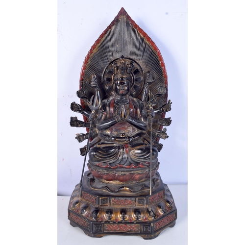 3182 - A Tibetan bronze Buddha sitting on a throne. 35cm high.