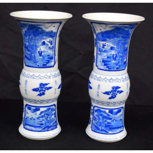 3185 - A pair of Chinese porcelain blue and white Yen Yen vases decorated with figures in a landscape. (2).... 