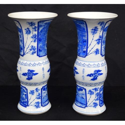 3185 - A pair of Chinese porcelain blue and white Yen Yen vases decorated with figures in a landscape. (2).... 