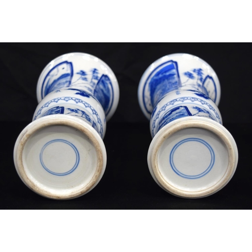 3185 - A pair of Chinese porcelain blue and white Yen Yen vases decorated with figures in a landscape. (2).... 