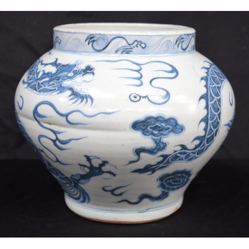 3187 - A Chinese porcelain blue and white vase decorated with a dragon. 20cm high.