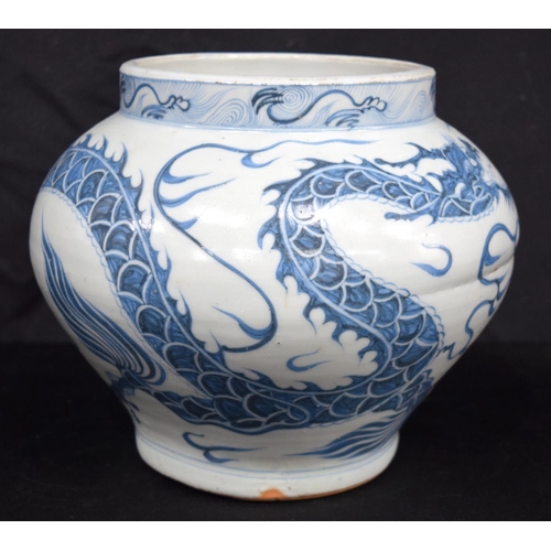 3187 - A Chinese porcelain blue and white vase decorated with a dragon. 20cm high.