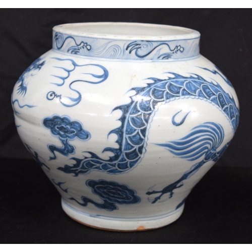 3187 - A Chinese porcelain blue and white vase decorated with a dragon. 20cm high.