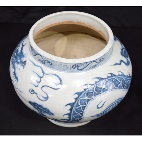 3187 - A Chinese porcelain blue and white vase decorated with a dragon. 20cm high.