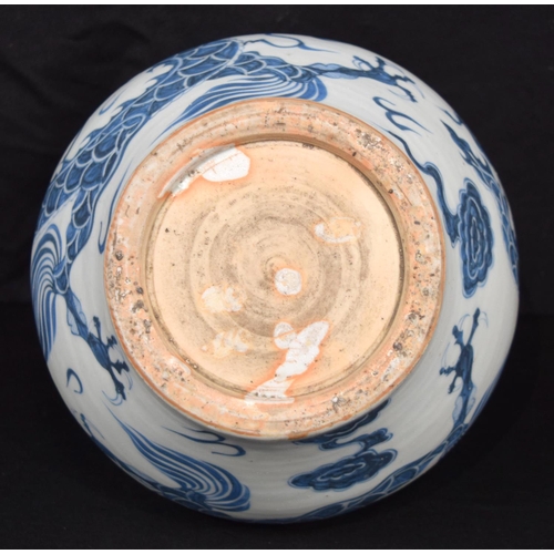 3187 - A Chinese porcelain blue and white vase decorated with a dragon. 20cm high.