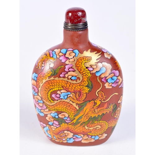 3202 - A Chinese Xining snuff bottle decorated with a dragon and phoenix. 9cm