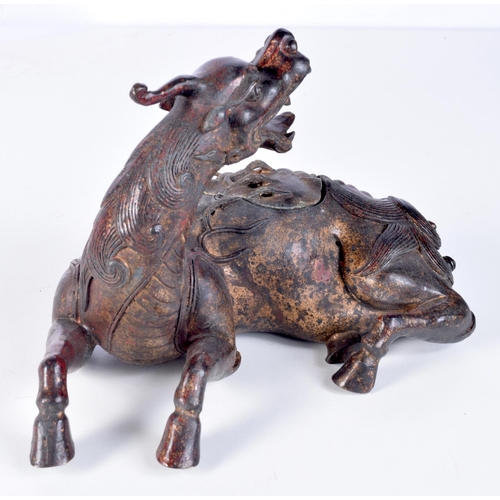 3206 - A Chinese bronze incense burner in a form of a beast. 17 x 25cm.