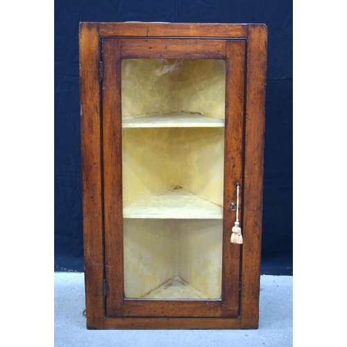 3532 - A glass fronted hanging corner display cabinet