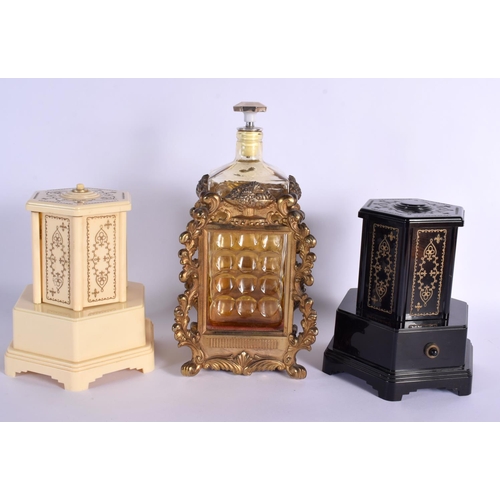 18 - THREE NOVELTY VINTAGE MUSIC BOXES one formed as a decanter. Largest 30 cm high. (3)