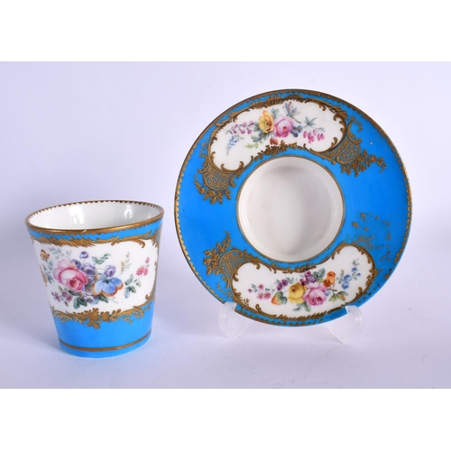 245 - 18TH CENTURY SEVRES TREMBLEUSE CUP AND SAUCER PAINTED WITH FLOWERS IN GILDED CARTOUCHES ON A TURQUOI... 