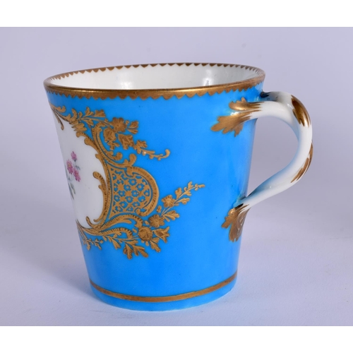 245 - 18TH CENTURY SEVRES TREMBLEUSE CUP AND SAUCER PAINTED WITH FLOWERS IN GILDED CARTOUCHES ON A TURQUOI... 