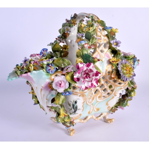 26 - A MID 19TH CENTURY CONTINENTAL PORCELAIN BASKET encrusted all over with foliage  painted with birds.... 