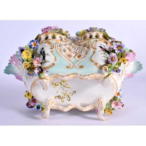 26 - A MID 19TH CENTURY CONTINENTAL PORCELAIN BASKET encrusted all over with foliage  painted with birds.... 