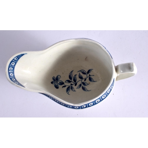 267 - 18TH CENTURY WORCESTER SAUCEBOAT PAINTED WITH THE STRAP FLUTED FLORAL PATTERN. 8.5cm High