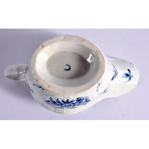 267 - 18TH CENTURY WORCESTER SAUCEBOAT PAINTED WITH THE STRAP FLUTED FLORAL PATTERN. 8.5cm High