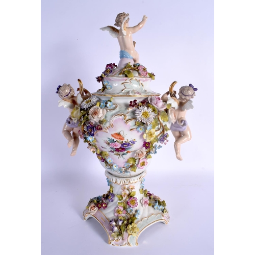 27 - A LARGE EARLY 20TH CENTURY GERMAN PORCELAIN VASE AND COVER with figural cherub supports. 42 cm x 24 ... 