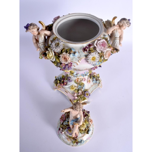 27 - A LARGE EARLY 20TH CENTURY GERMAN PORCELAIN VASE AND COVER with figural cherub supports. 42 cm x 24 ... 