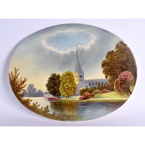 279 - 19TH CENTURY ENGLISH CREAMWARE OVAL PLAQUE PAINTED WITH A CHURCH ON A RIVER. 33cm Long x 25.4cm Wide