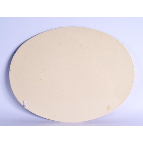 279 - 19TH CENTURY ENGLISH CREAMWARE OVAL PLAQUE PAINTED WITH A CHURCH ON A RIVER. 33cm Long x 25.4cm Wide