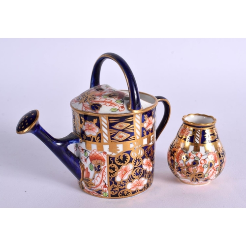 286 - ROYAL CROWN DERBY WATERING CAN PAINTED WITH PATTERN 6299 DATE MARK 1911AND A SMALL VASE SIMILAR DATE... 