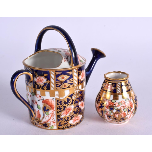 286 - ROYAL CROWN DERBY WATERING CAN PAINTED WITH PATTERN 6299 DATE MARK 1911AND A SMALL VASE SIMILAR DATE... 