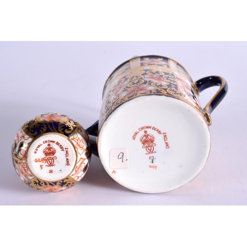 286 - ROYAL CROWN DERBY WATERING CAN PAINTED WITH PATTERN 6299 DATE MARK 1911AND A SMALL VASE SIMILAR DATE... 