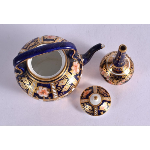 289 - ROYAL CROWN DERBY KETTLE AND COVER PAINTED WITH PATTERN 6299 DATE MARK 1919 AND A BOTTLE VASE SIMILA... 