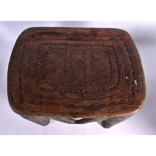 366 - A LARGE NEAR PAIR OF EARLY 20TH CENTURY AFRICAN TRIBAL WOOD STOOLS with chip carved decoration. Larg... 
