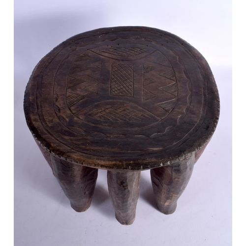 366 - A LARGE NEAR PAIR OF EARLY 20TH CENTURY AFRICAN TRIBAL WOOD STOOLS with chip carved decoration. Larg... 