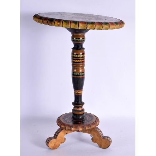 367 - AN UNUSUAL INDIAN PAINTED WOODEN TABLE depicting a female having her feet washed. 44 cm x 20 cm.