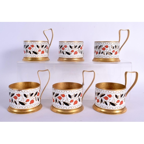 371 - SIX VINTAGE RUSSIAN YELLOW METAL CUP HOLDERS decorated with enamelled fruiting vines. 9 cm x 10 cm. ... 