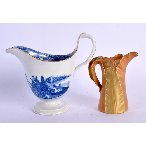 375 - A ROYAL WORCESTER BLUSH IVORY JUG together with a blue and white helmet jug. Largest 10 cm high. (2)