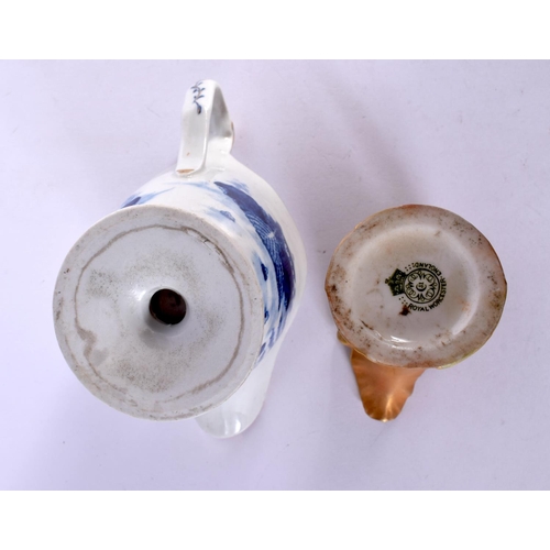 375 - A ROYAL WORCESTER BLUSH IVORY JUG together with a blue and white helmet jug. Largest 10 cm high. (2)