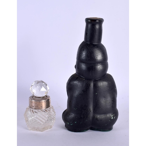 377 - A VERY UNUSUAL SOUTH AMERICAN STYLE GLASS SCENT BOTTLE with contents  together with a silver mounted... 