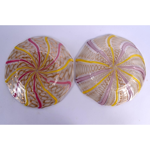 38 - AN UNUSUAL PAIR OF EARLY 20TH CENTURY GLASS TWIST PLATES with pink swirling decoration. 19 cm wide.