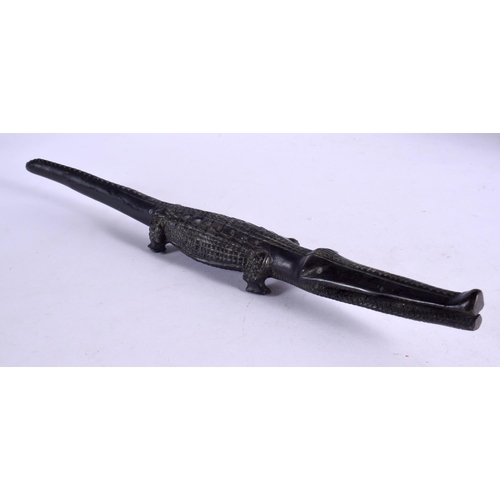 380 - AN EARLY 20TH CENTURY AFRICAN TRIBAL CARVED EBONY CROCODILE. 40 cm long.