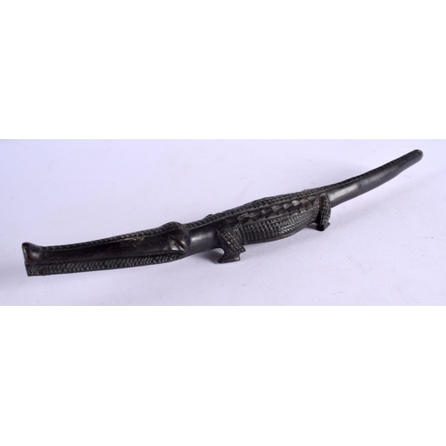 380 - AN EARLY 20TH CENTURY AFRICAN TRIBAL CARVED EBONY CROCODILE. 40 cm long.