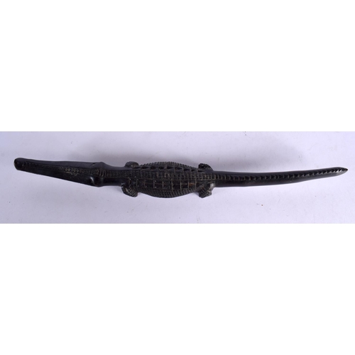 380 - AN EARLY 20TH CENTURY AFRICAN TRIBAL CARVED EBONY CROCODILE. 40 cm long.